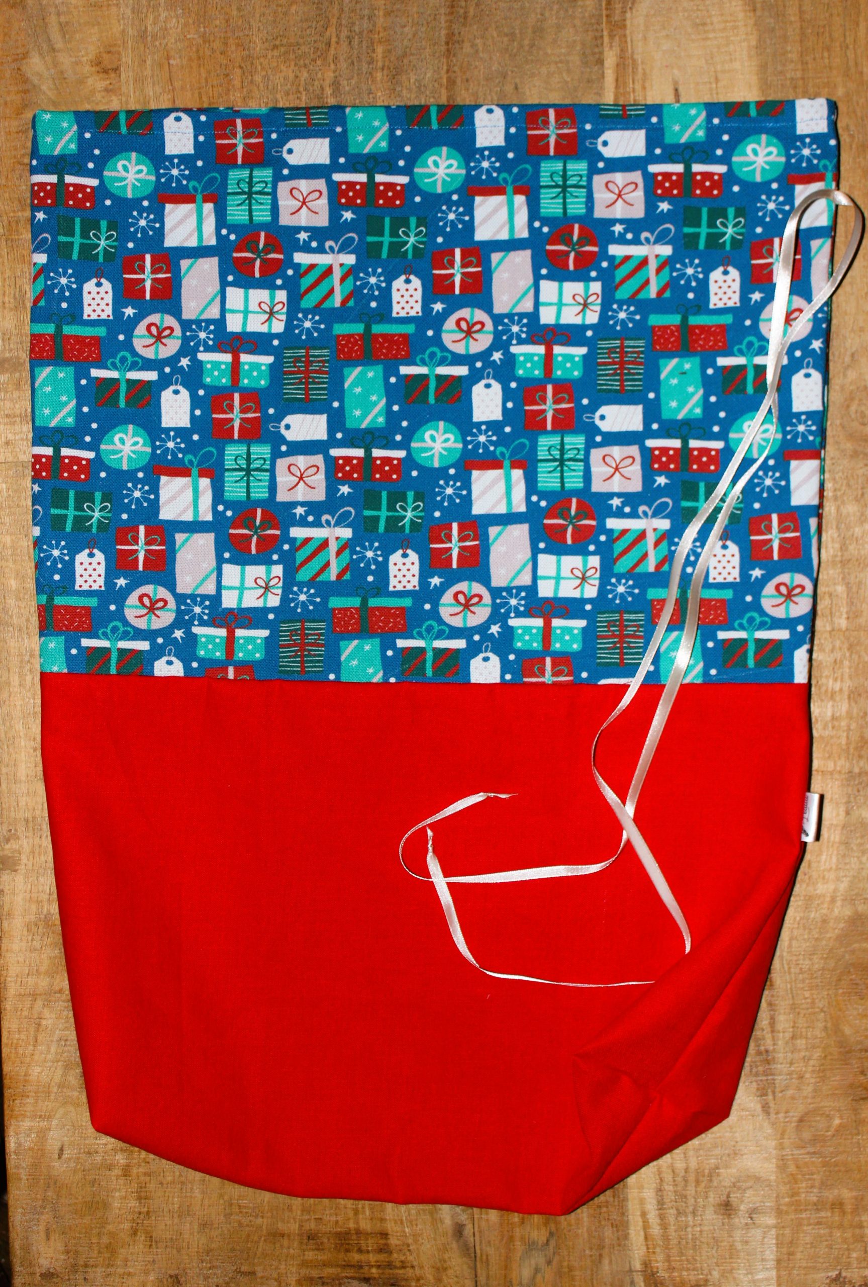 Hotte Père Noël cadeau rouge